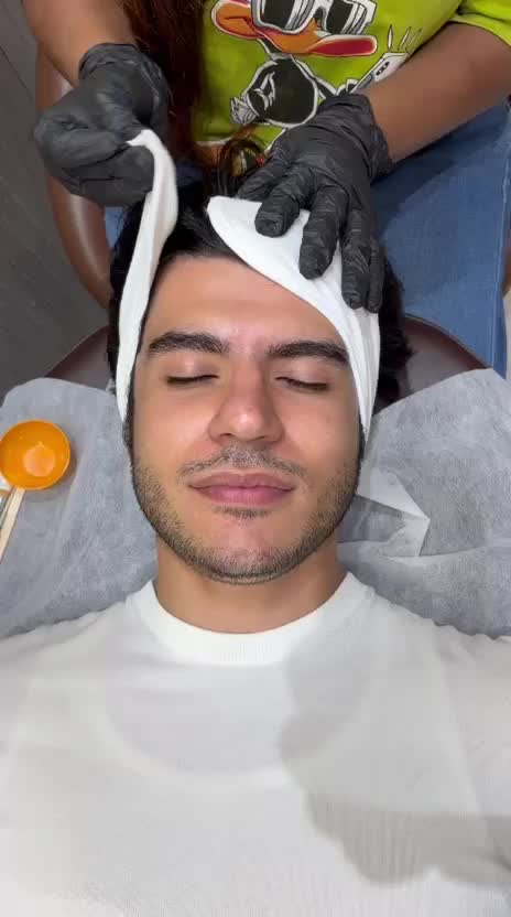 A client receiving a skin treatment at IPSA
